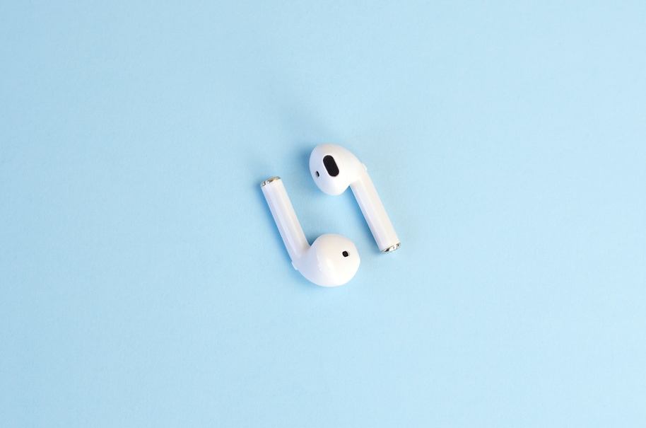 Wireless White Headphones on a Blue Background